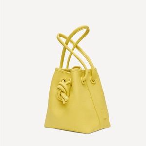 New never used VASIC calf leather pebble knot detail mustard drawstring handbag